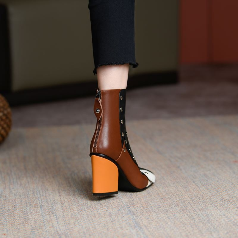 Fashion women's brown leather ankle boots with multicolour design and high heels, showcasing stylish rivets.