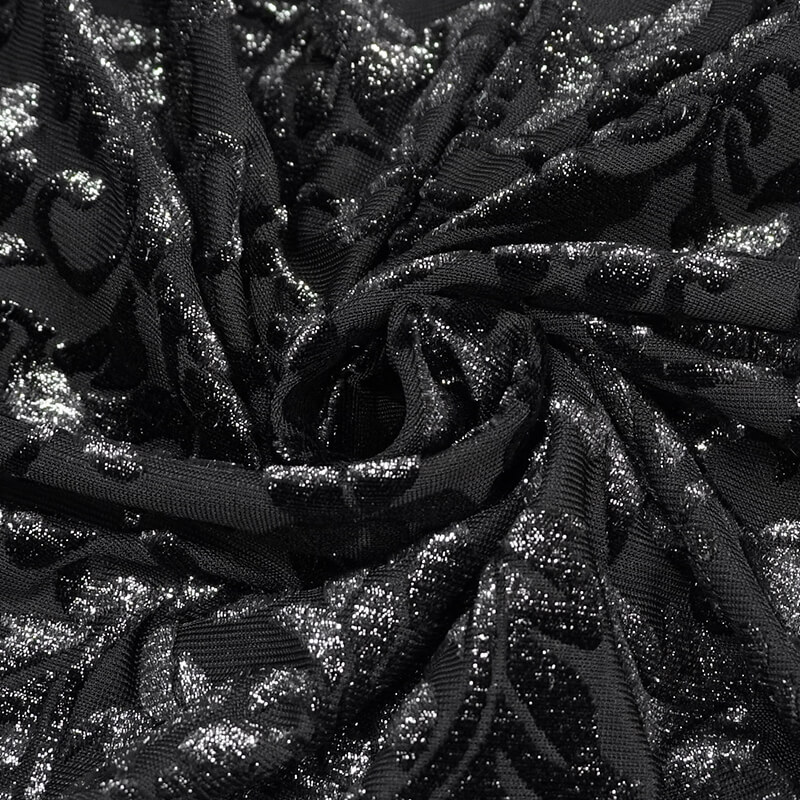 Close-up of luxurious black fabric with shimmering silver detailing, showcasing gothic floral patterns for stylish crop tops.
