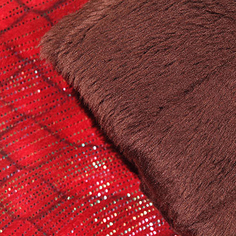 Close-up of soft brown fur on a red sparkly background, perfect for adding elegance to winter fashion.