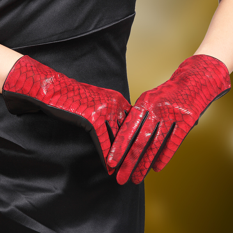 Stylish red women's leather gloves with a unique textured design, perfect for adding elegance to winter outfits.