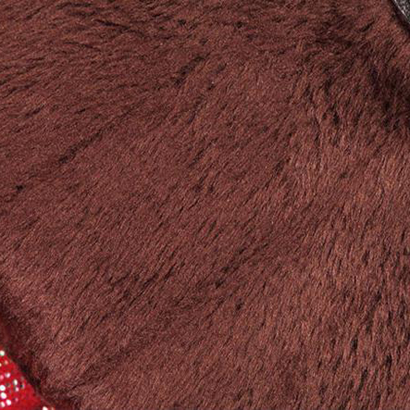 Close-up of soft, brown fur lining from women's elegant leather gloves, showcasing warmth and luxury.