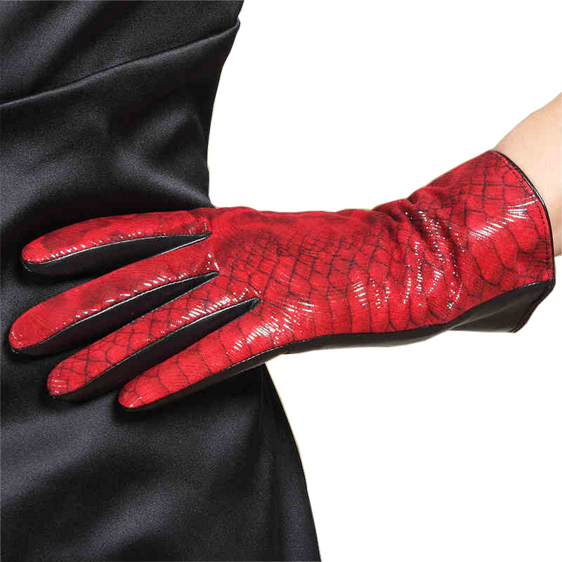 Elegant red leather women's gloves featuring a sophisticated crocodile pattern, perfect for stylish winter wear.