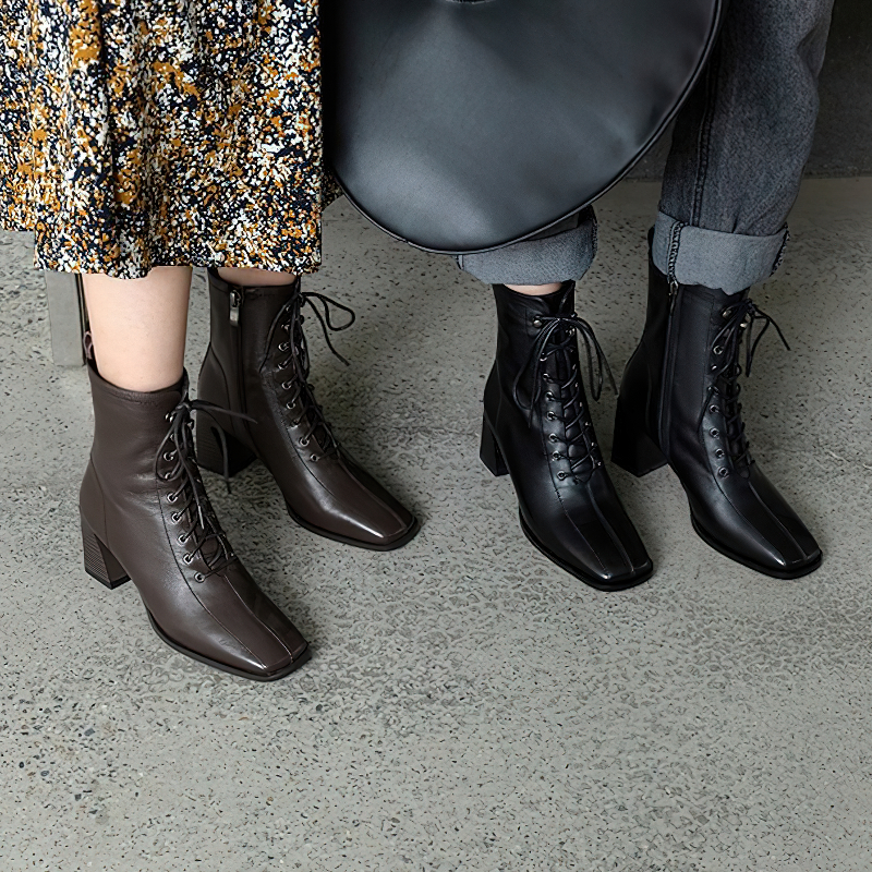 Stylish women's ankle boots in brown and black genuine leather, ideal for chic casual outfits.