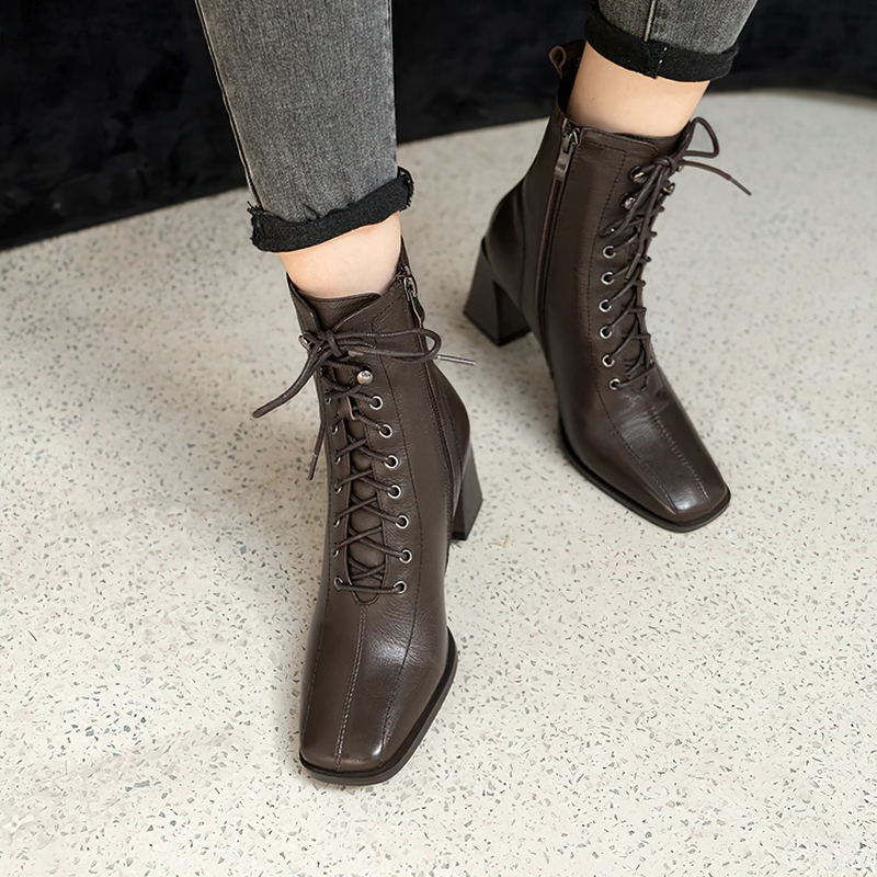 Stylish women's ankle boots in brown genuine leather with laces and block heels, perfect for casual outfits.