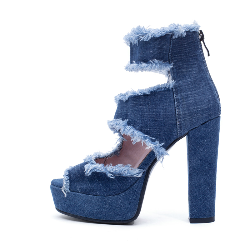 Trendy women's high heel zip sandals in denim with frayed edges, perfect for summer fashion statements.