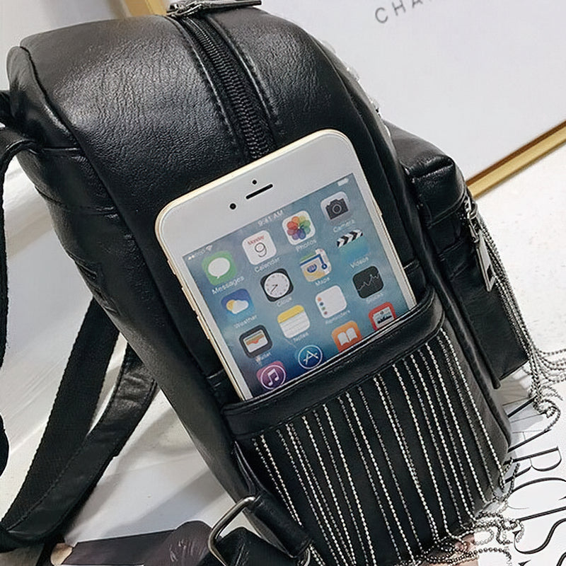 Fashionable black mini backpack with phone pocket and rivet details, perfect for casual outings.