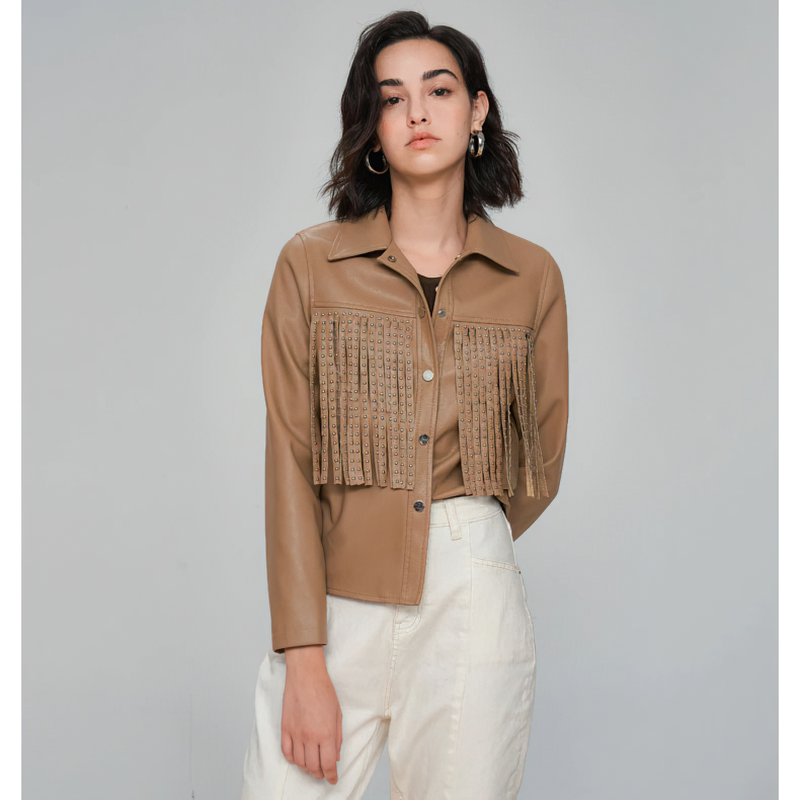 Trendy women's PU leather jacket in tan with fringe details, perfect for a punk rock biker look.