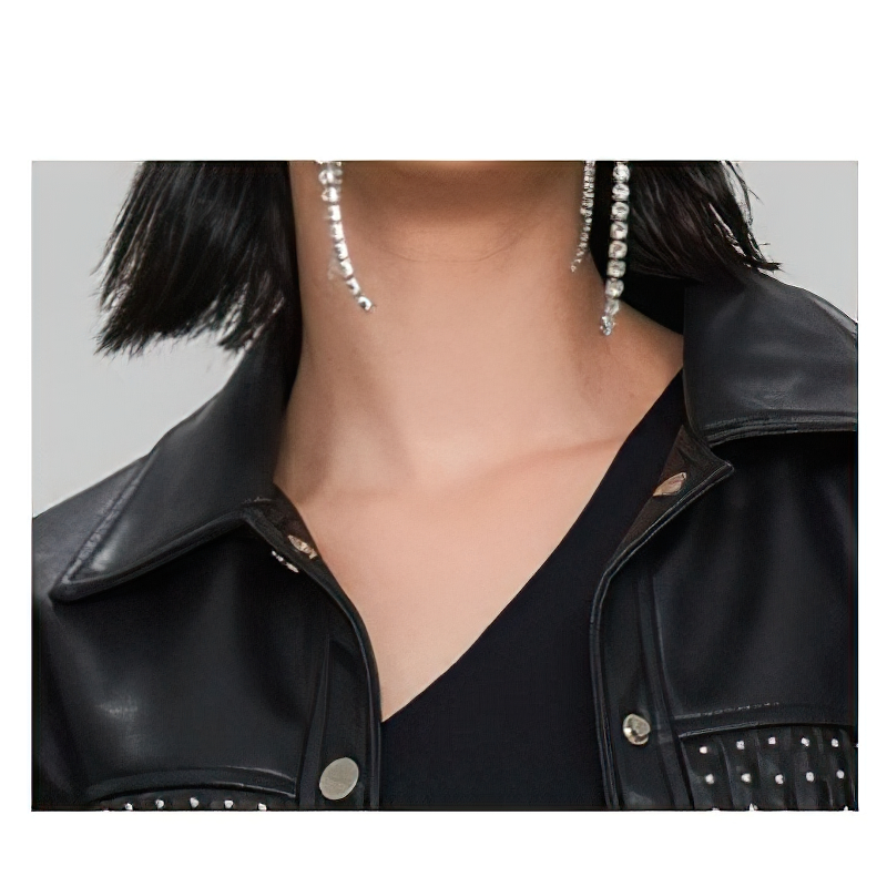 Close-up of a woman's neck and shoulders in a stylish black PU leather jacket with silver rivets.