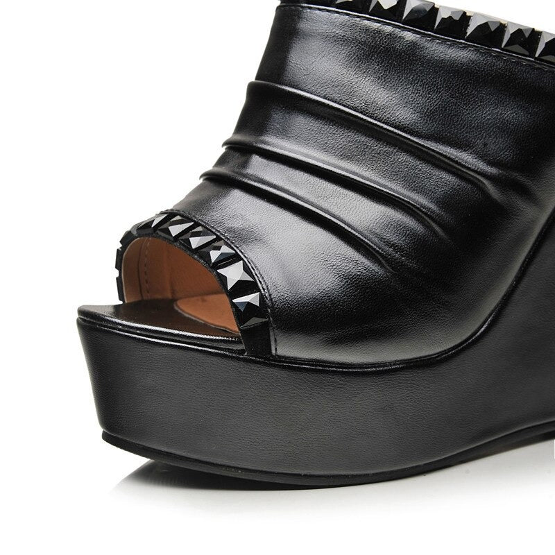 Black PU leather open toe sandals with a platform and studded detailing, perfect for summer fashion.