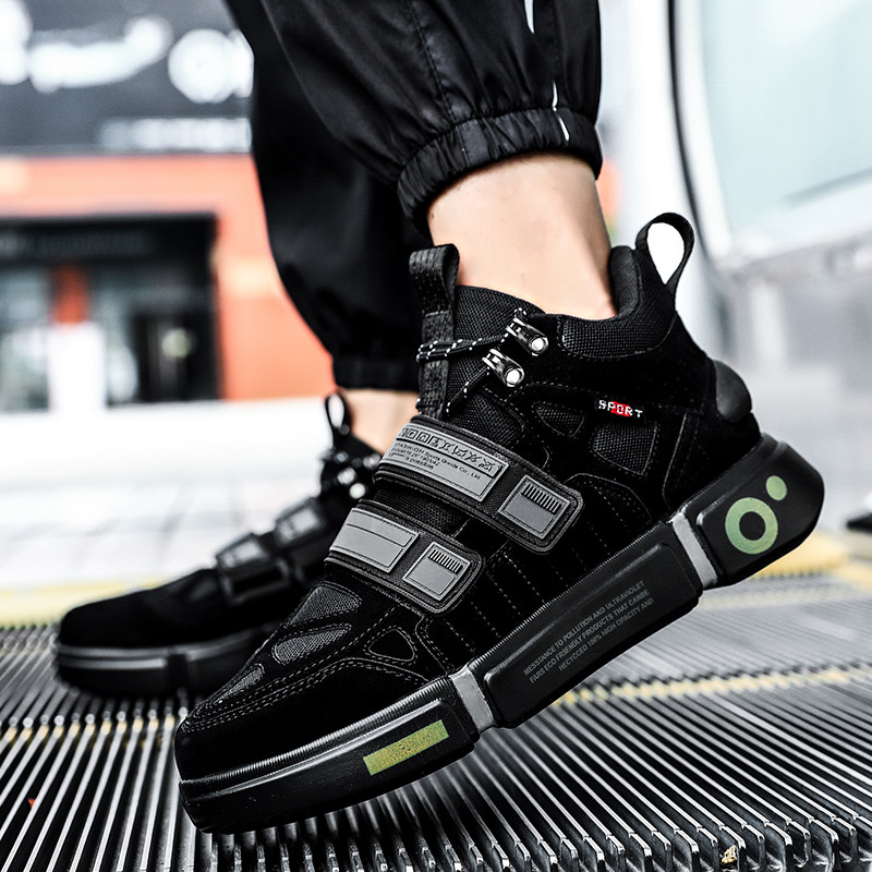 Fashionable black platform sneakers with cross tie design, perfect for trendy street style and comfort.