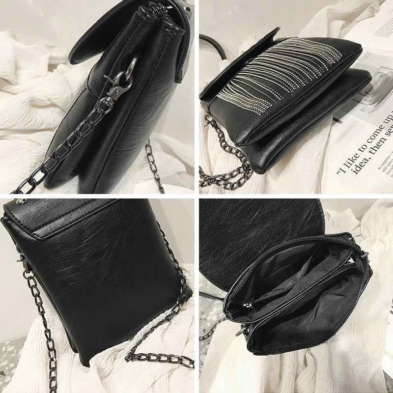 Black women's shoulder bag with decorative chain and fringe, featuring multiple pockets for easy storage.