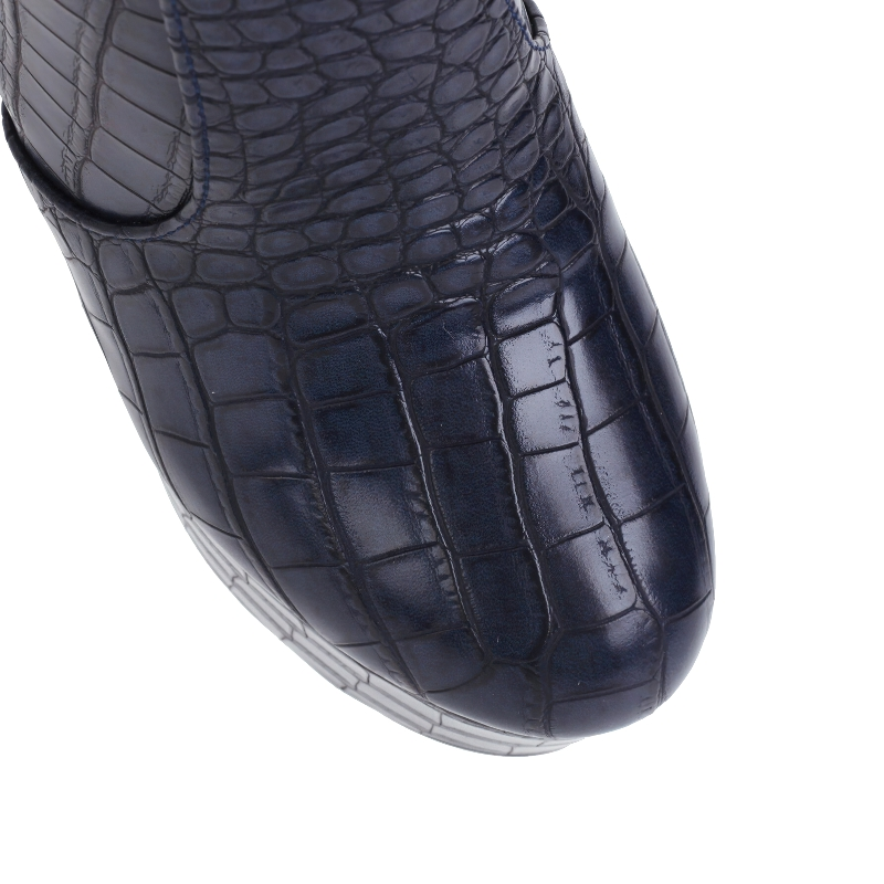 Close-up of women's square high heel shoes with trendy crocodile print in dark navy color.