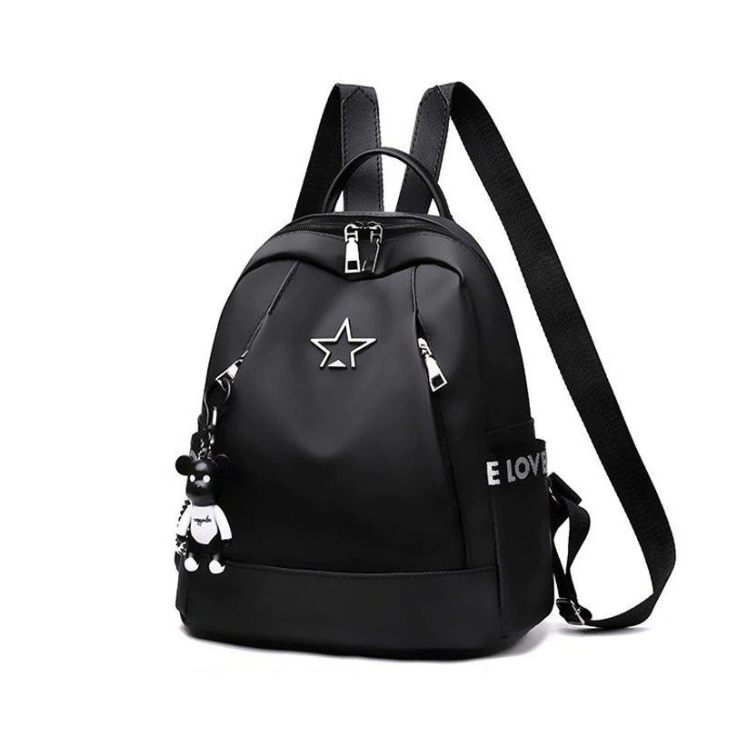 Stylish women's black PU leather backpack with star design and charm, perfect for travel and casual outings.