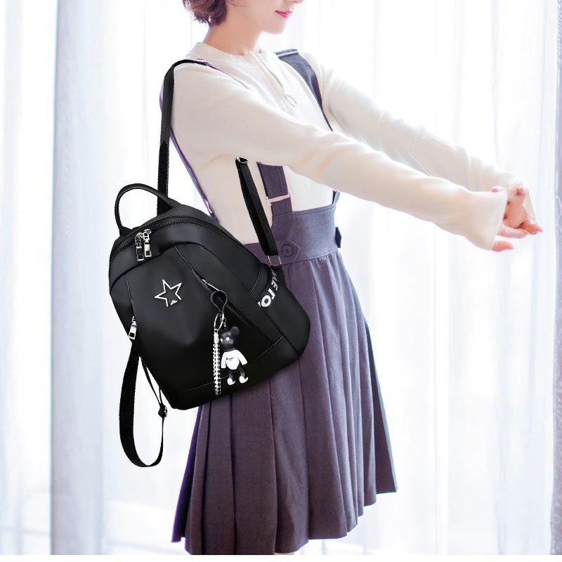 Stylish women's black PU leather backpack with pockets, perfect for casual travel and outfits.