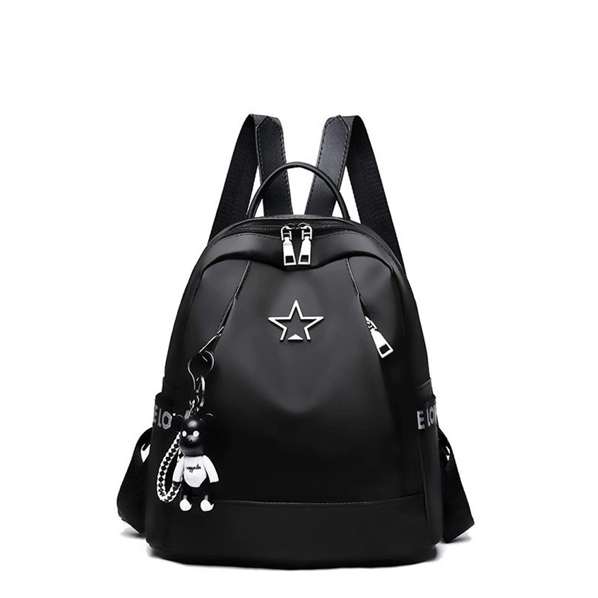 Stylish women's travel black PU leather backpack with star design and cute keychain, perfect for casual outings.