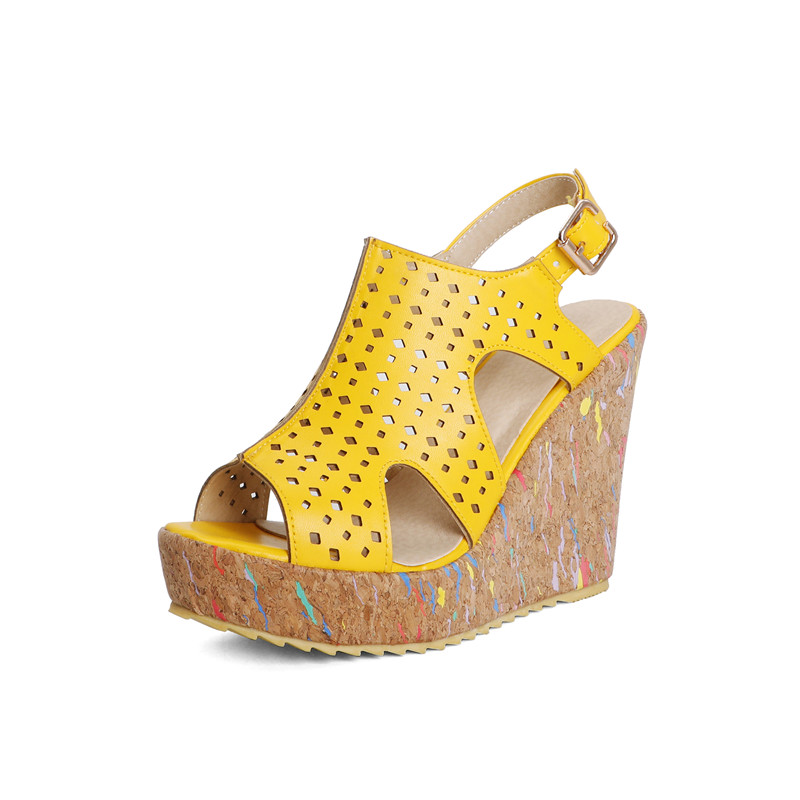 Trendy yellow women's wedge sandals with side cutouts and cork platform, perfect summer footwear for casual outfits.