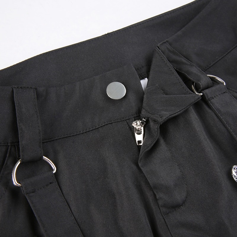 Close-up of women's punk style black wide-leg cargo pants featuring a zippered fly and silver chain details.