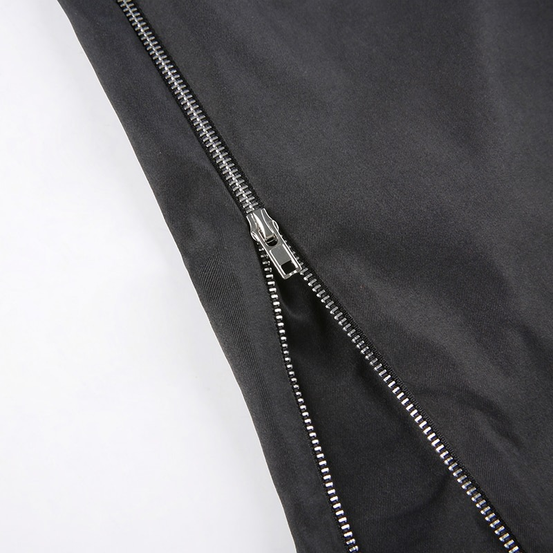 Close-up of zipper detail on women's wide leg black cargo pants in punk style, highlighting edgy fashion.