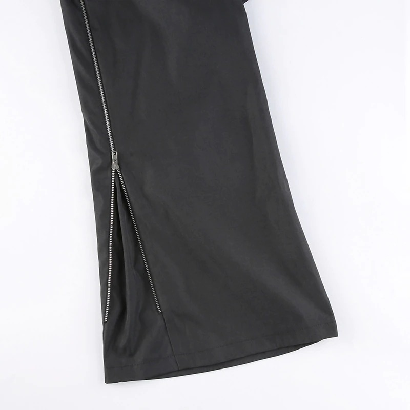 Close-up of trendy women's black wide-leg cargo pants featuring stylish zip details and a punk-inspired design.