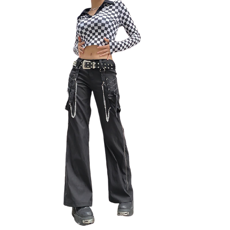 Trendy women's wide-leg black cargo pants with chains, styled in punk fashion, paired with a checkered crop top.