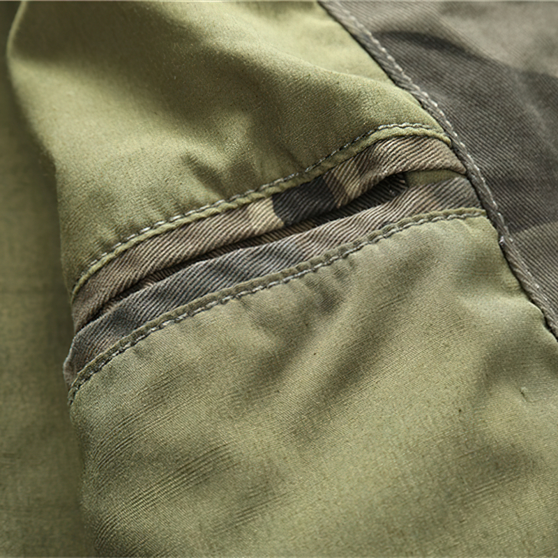 Close-up of stylish camo denim jacket showcasing pocket details and stitching.