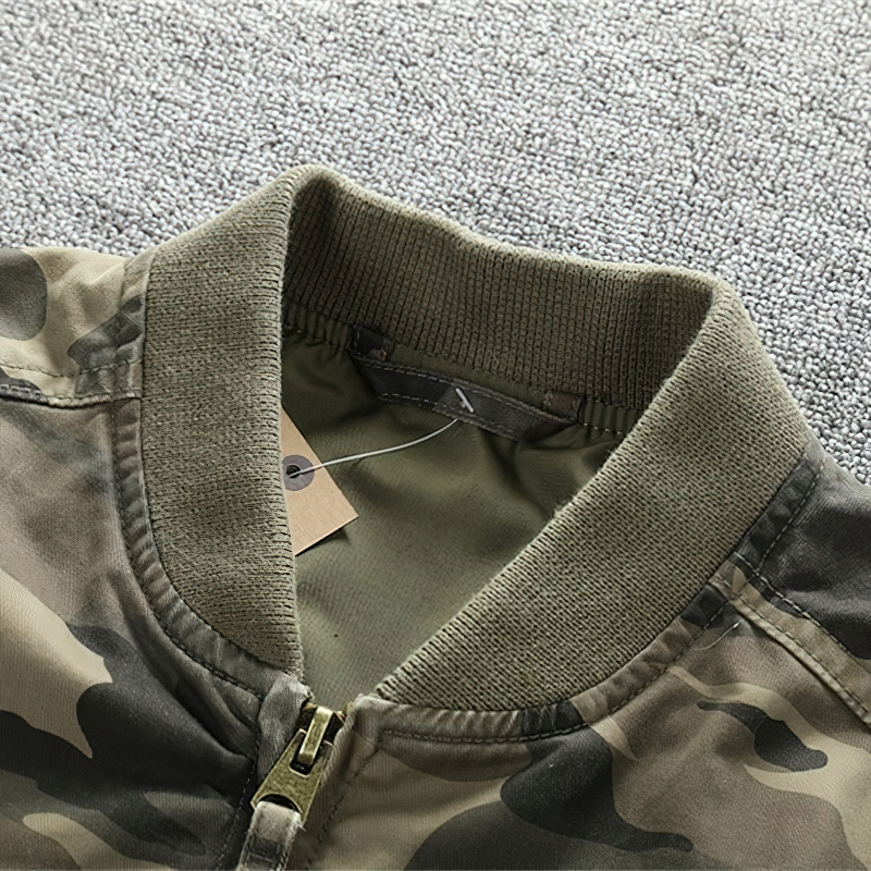 Close-up of the stylish collar on a men's camo denim jacket, showcasing its trendy military design and quality materials.