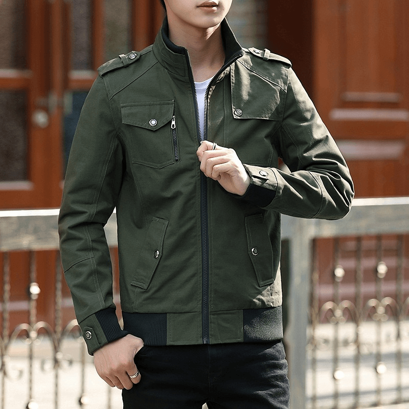 Stylish male model wearing a green military-style zipper jacket with pockets, perfect for casual outings.