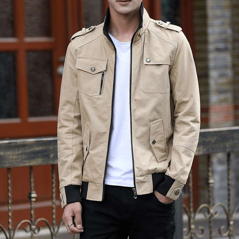 Stylish male model wearing a beige military-style zipper jacket with pockets, perfect for casual outings and modern fashion.