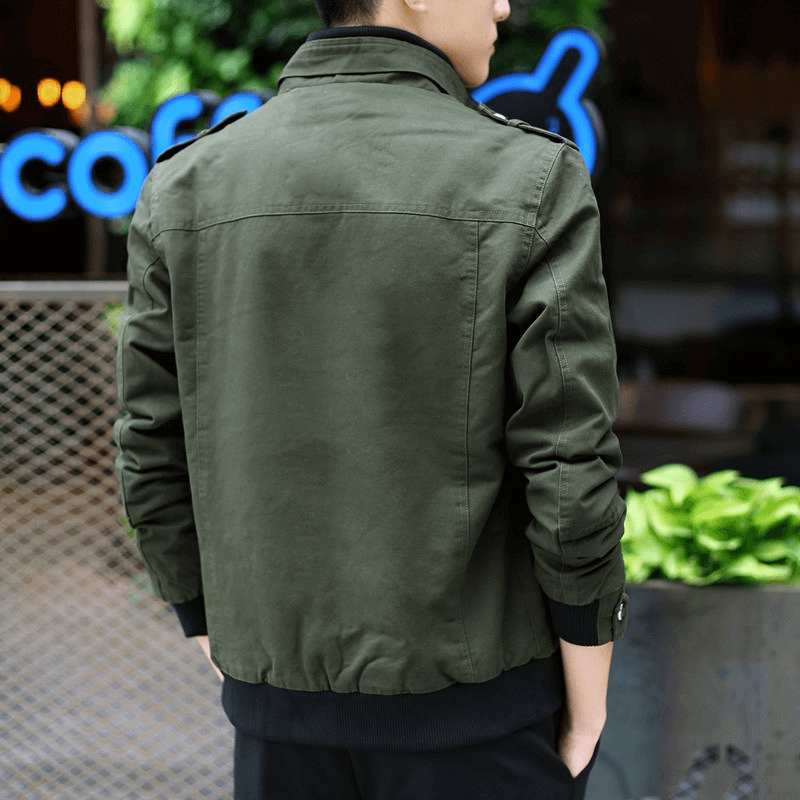 Stylish male model wearing a military green zipper jacket with pockets, showcasing modern design and casual fit.