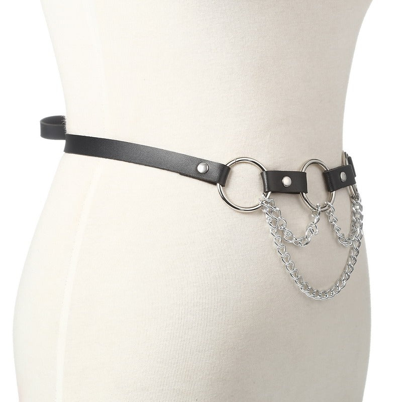 Sleek faux leather body harness with metal chain details for women, perfect for gothic and edgy styles.
