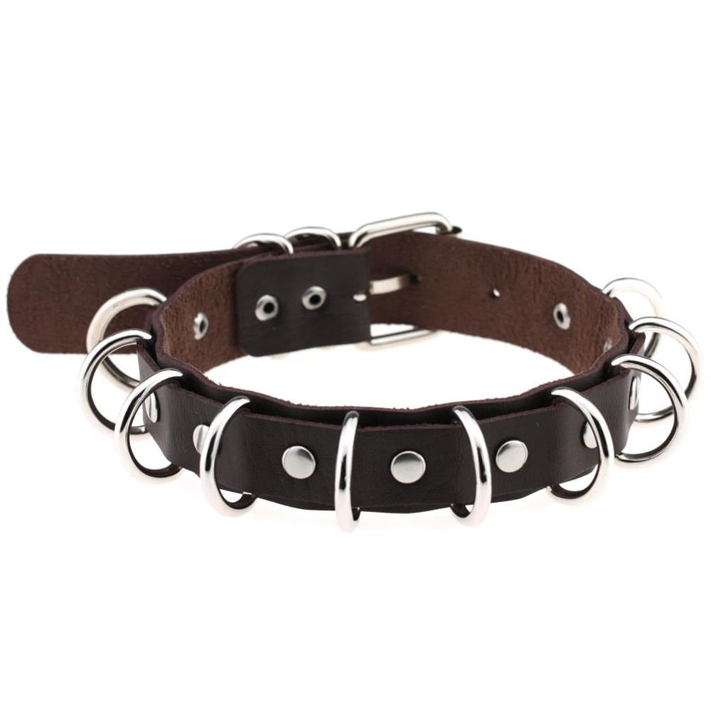 Faux leather choker with metal rings, perfect for gothic and vintage rock fashion enthusiasts.
