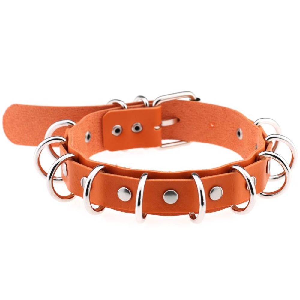 Faux leather choker with metal rings, perfect for goth and vintage rock fashion lovers.