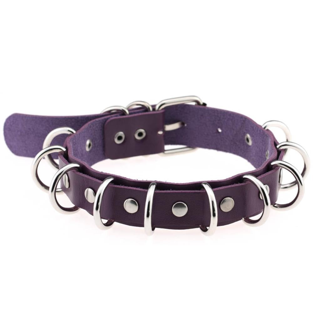 Purple faux leather choker with metal rings, a stylish goth accessory for punk rock fashion.