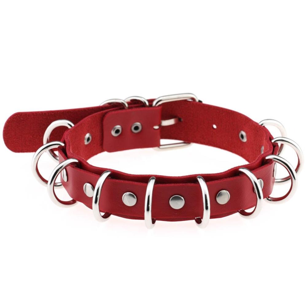 Red faux leather choker with metal rings and studs, perfect for goth accessories and punk fashion.