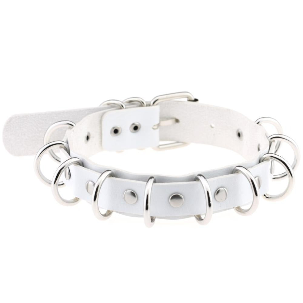 Faux leather white choker with metal rings, stylish goth accessory for vintage rock and punk fashion.