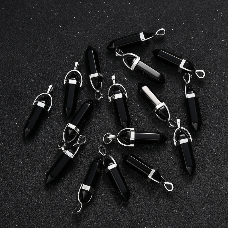 Collection of black hexagonal stone pendants with silver accents for gothic style jewelry making.