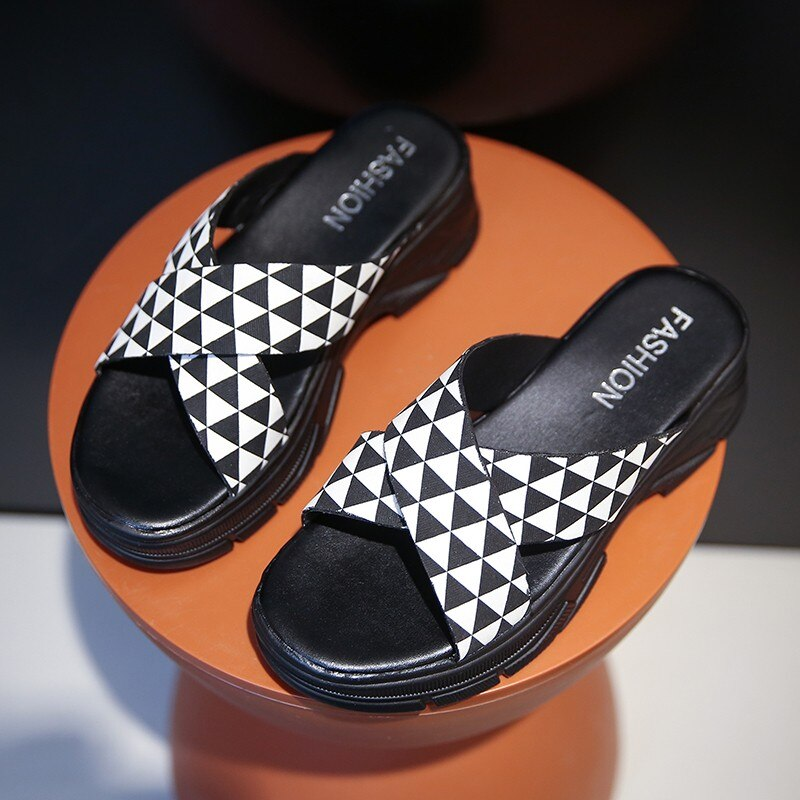 Stylish black and white alternative style sandals with geometric design, perfect for a chic aesthetic look.