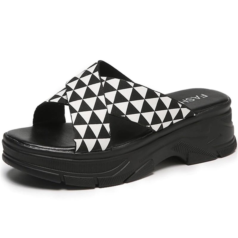 Trendy black and white alternative style sandals for women with a unique geometric design.