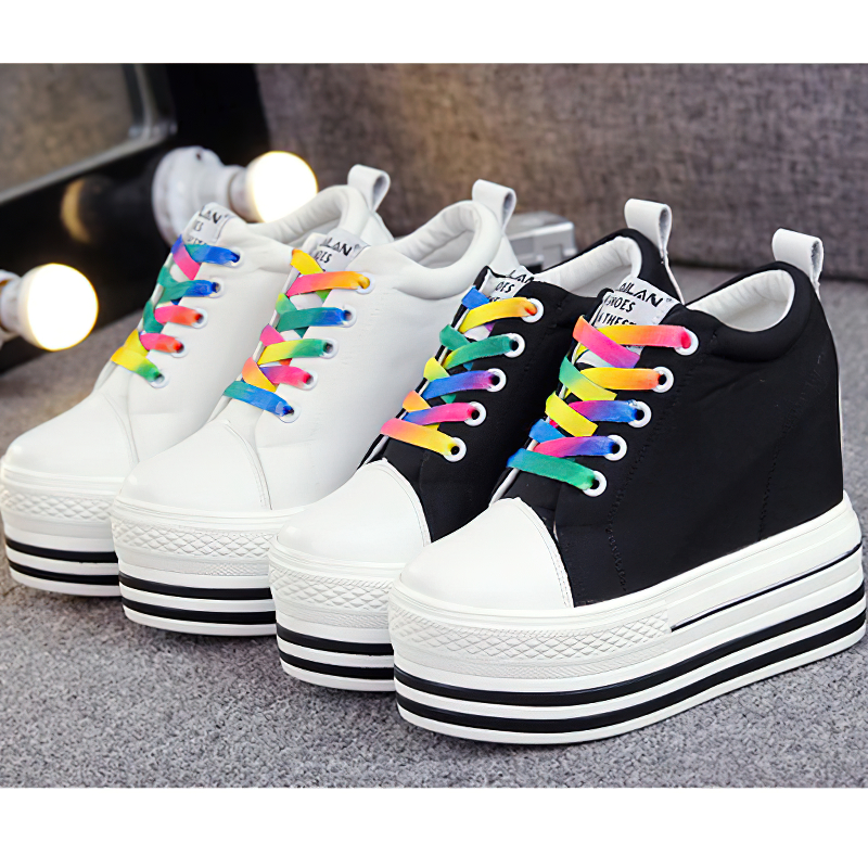 Stylish female canvas platform sneakers in black and white, featuring colorful laces and a chic, modern design.