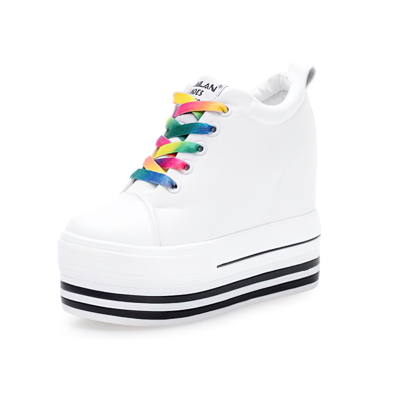 White women's canvas platform sneakers with colorful laces and black-striped sole, perfect for any casual outfit.
