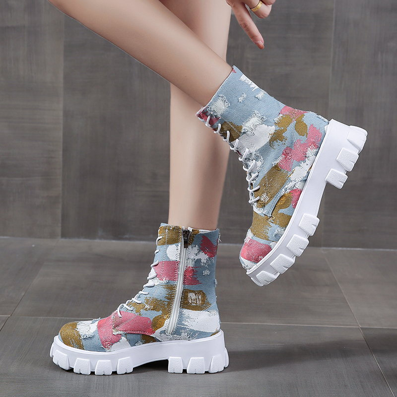 Trendy female combat boots with colorful design and side zipper, perfect for alternative style and rocker girl outfits.