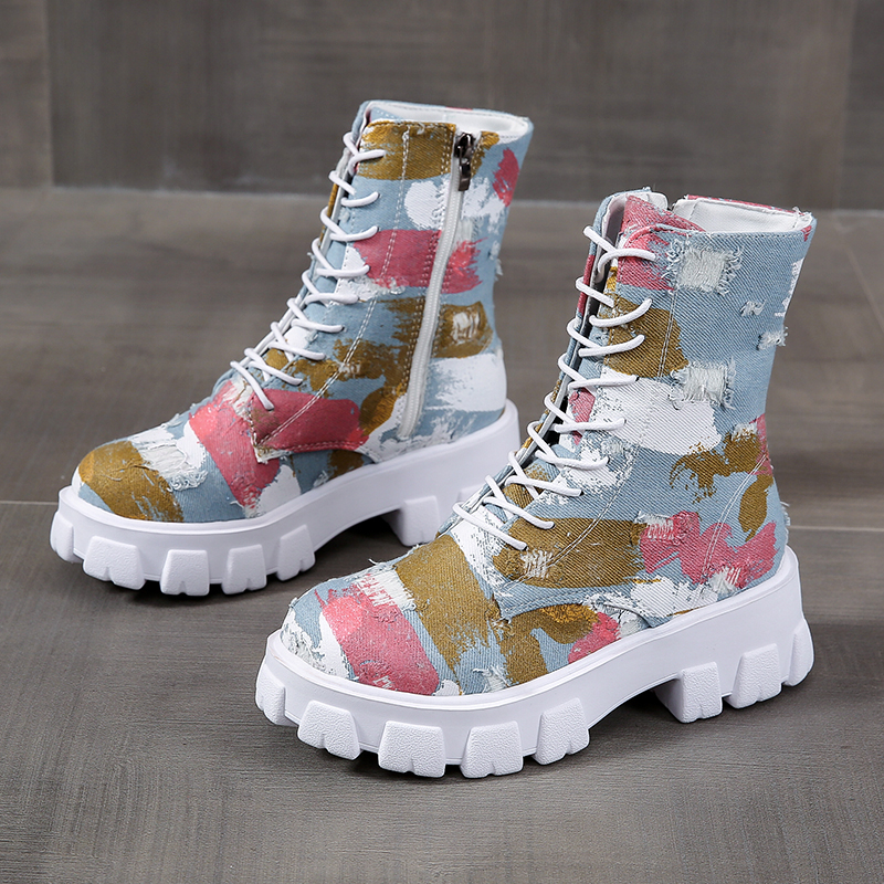 Trendy women's combat boots with colorful print, lace-up design, and side zipper for stylish alternative look.