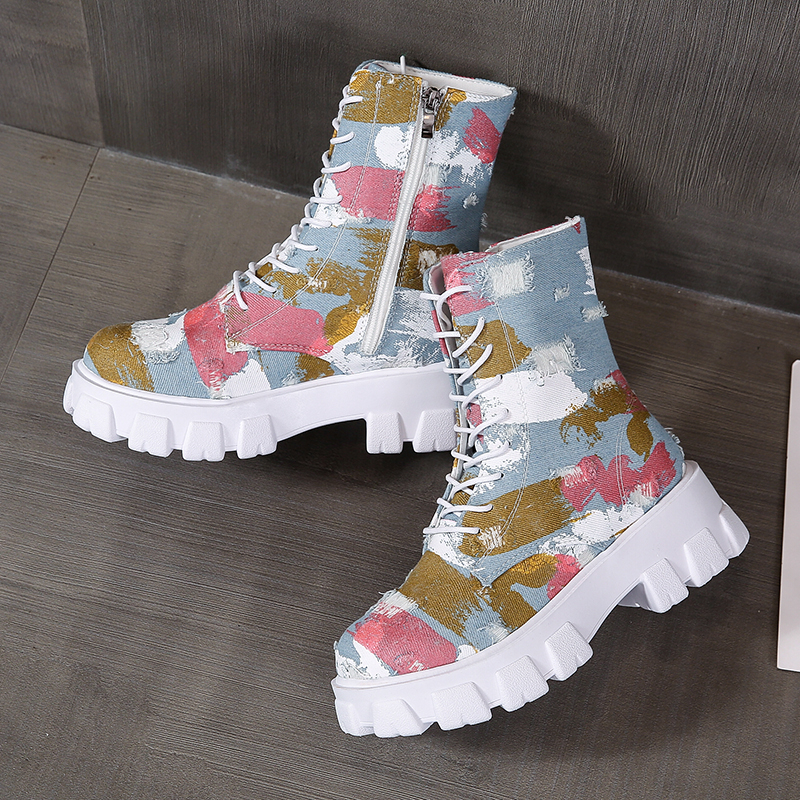 Trendy women's combat boots in alternative style with colorful print and side zipper, perfect for rocker outfits.