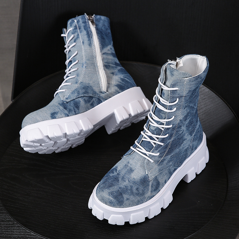 Trendy women's combat boots in blue tie-dye style with laces and side zipper for a cool alternative look.