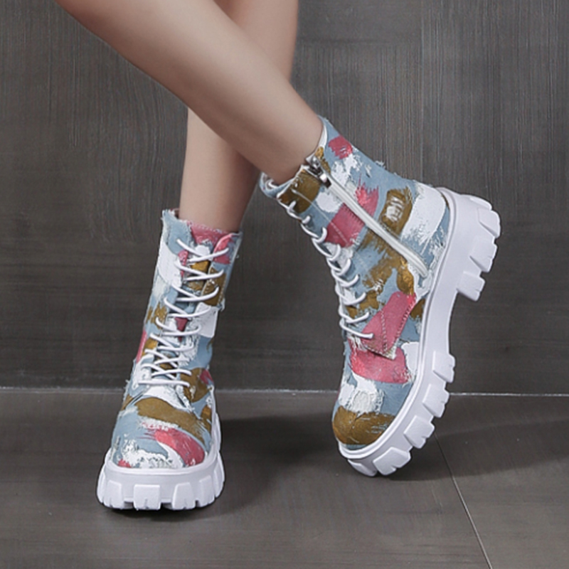 Trendy women's combat boots in alternative style with colorful print and side zipper for stylish rocker girl look.