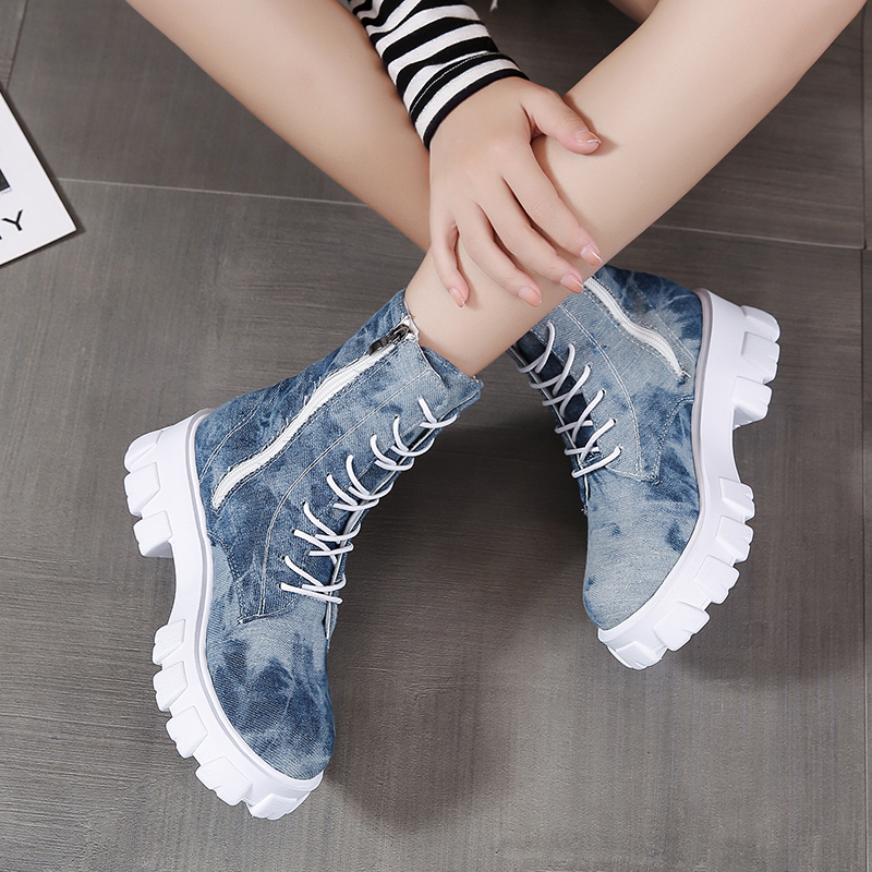 Trendy women's alternative style combat boots in denim with white sole and side zipper for a rocker girl look.