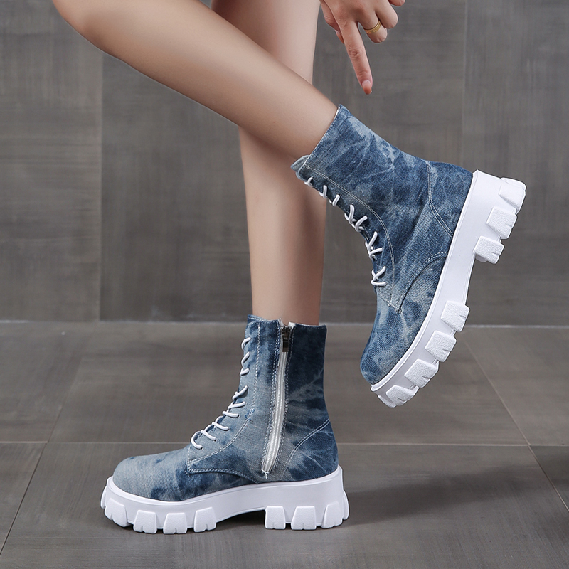 Stylish women's combat boots in denim print with zipper and chunky white sole, perfect for rocker girl outfits.