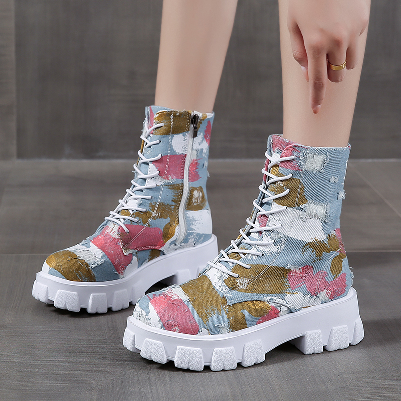 Trendy women's alternative style combat boots with colorful print and side zipper for a rocker girl look.