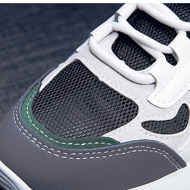 Close-up of female lace-up sneakers showcasing stylish patchwork design and breathable mesh for casual sports wear.