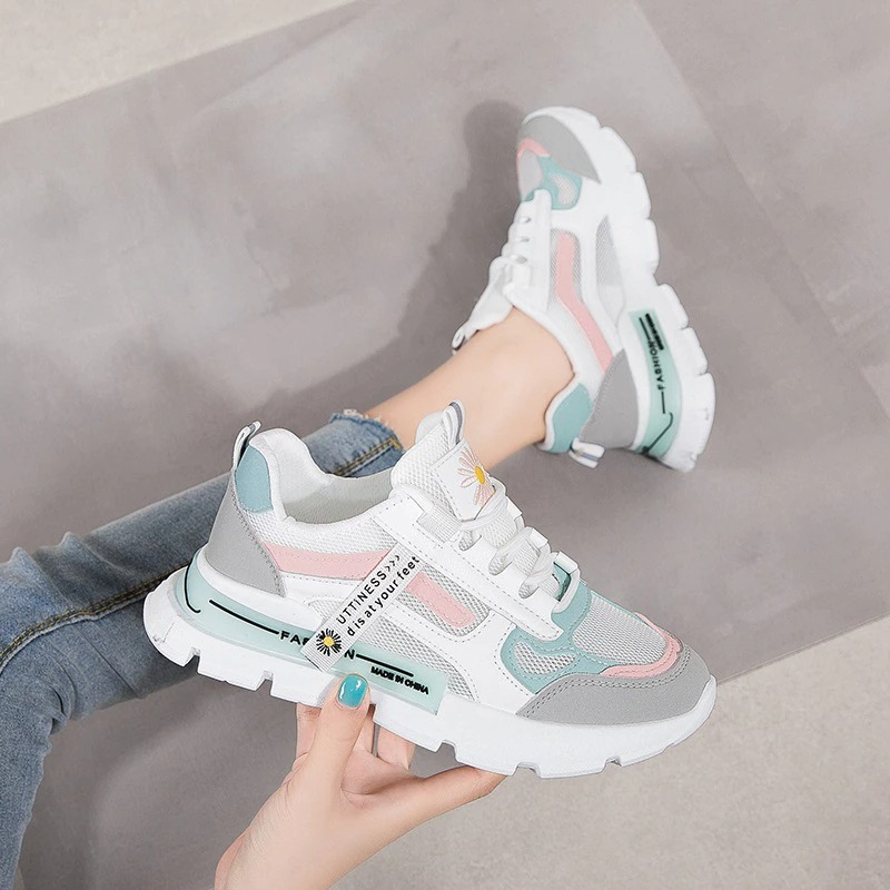 Stylish female lace up sneakers with daisies in pink and mint colors, perfect for casual sports and spring wear.